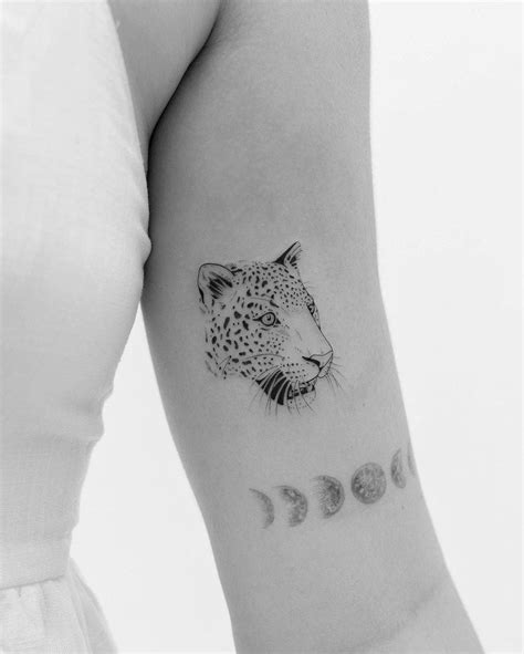 minimalist leopard tattoo.